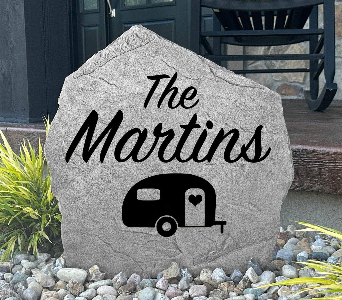 Personalized camper stone engraved with family name and heart design.