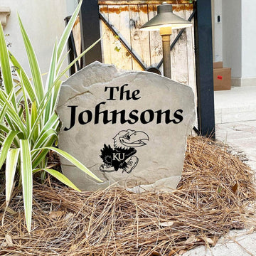 Custom University of Kansas Jayhawks Name Stone featuring the official university logo and your personalized family name. A beautiful landscape accent for gardens, patios, front entryways, and flower beds.