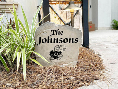 Decorative landscape stone displaying Kansas Jayhawks logo and name