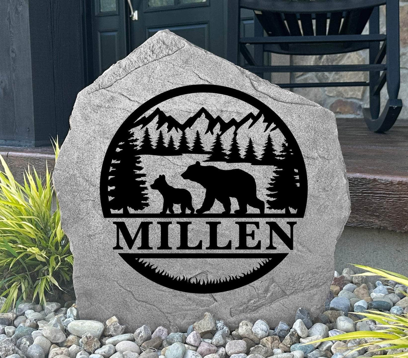 Engraved rock with bear and cub in a forest scene, ideal for landscaping or porch display.