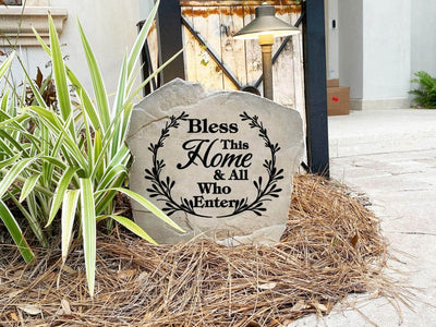 Landscaping stone with engraved welcome and leaf design