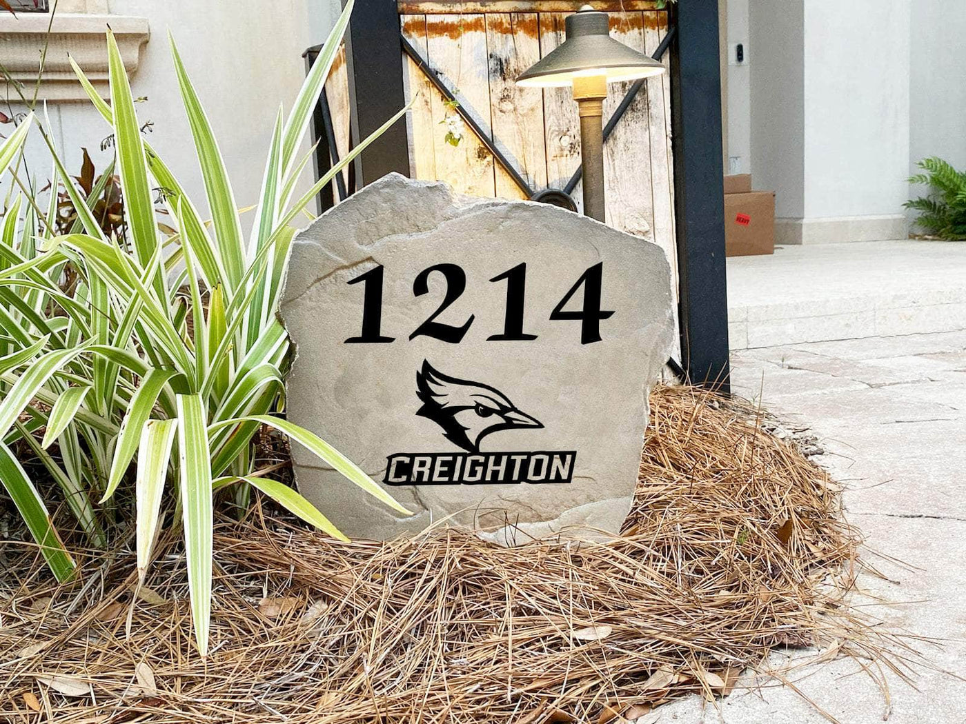 Outdoor Creighton University address stone with engraved details