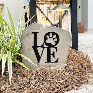 Heartwarming canine landscape stone designed for dog lovers who want to showcase their passion for man's best friend in their outdoor décor.
