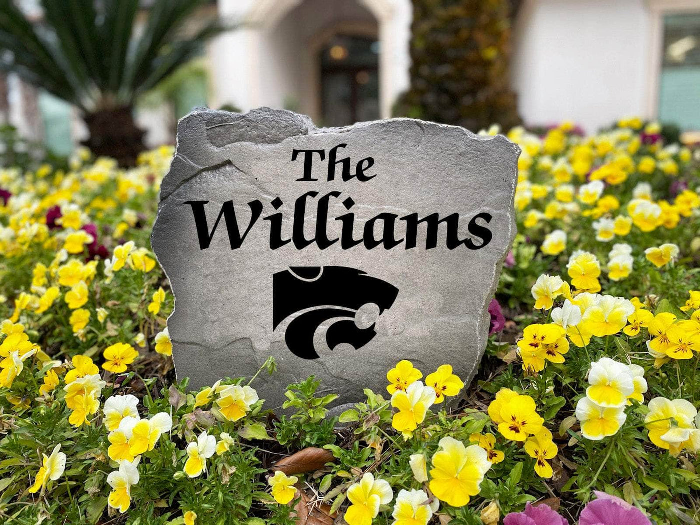 Outdoor stone decor with Kansas State logo and family name