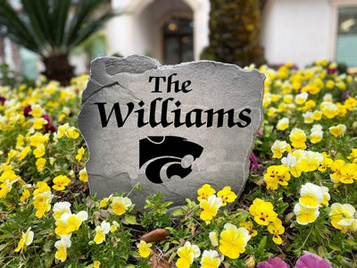 Outdoor stone decor with Kansas State logo and family name