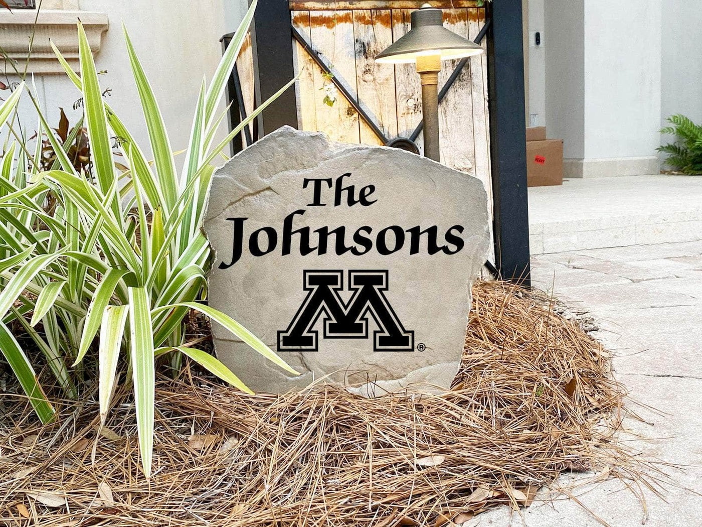 Durable Minnesota name rock with personalized engraving for garden or yard decor.