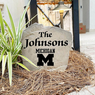 Engraved University of Michigan Name Stone with a custom family name and the Michigan Wolverines logo, bringing collegiate spirit and timeless style to front yard landscapes, walkways, and home entrances.
