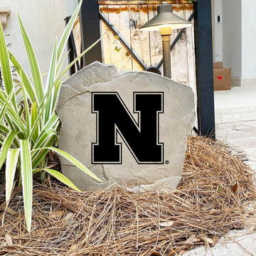 Nebraska Huskers decorative yard stone featuring the iconic team logo, designed to elevate flower beds, walkways, and outdoor living spaces.