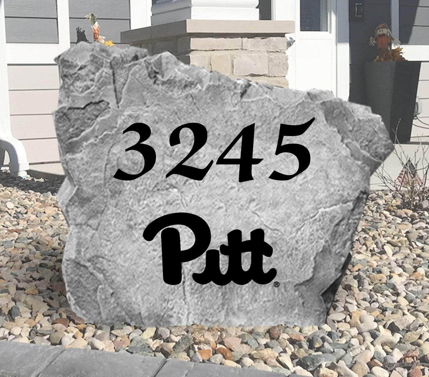 Outdoor landscaping rock featuring Pitt Panthers logo and house number