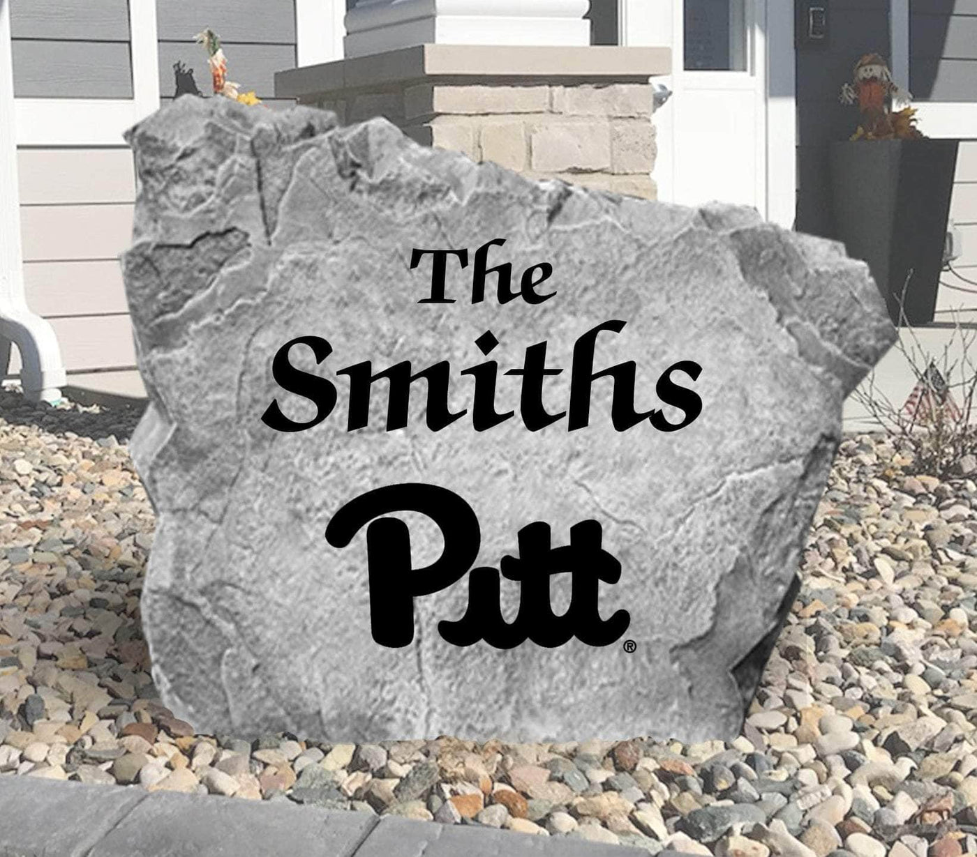Outdoor landscaping rock featuring Pitt Panthers script