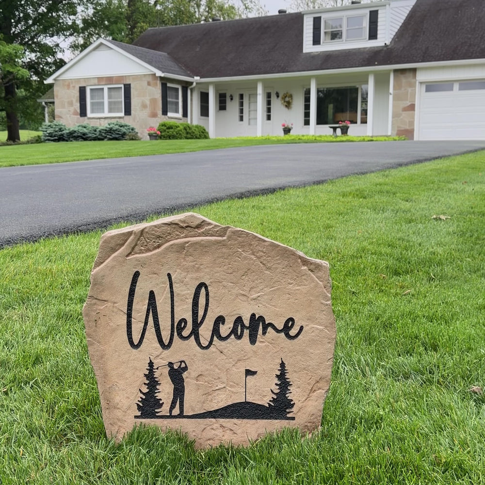 Engraved Welcome Golf Stone nestled among colorful flowers and greenery, bringing golf course charm and timeless style to front yard landscaping. Perfect for patios, gardens, and outdoor living spaces.