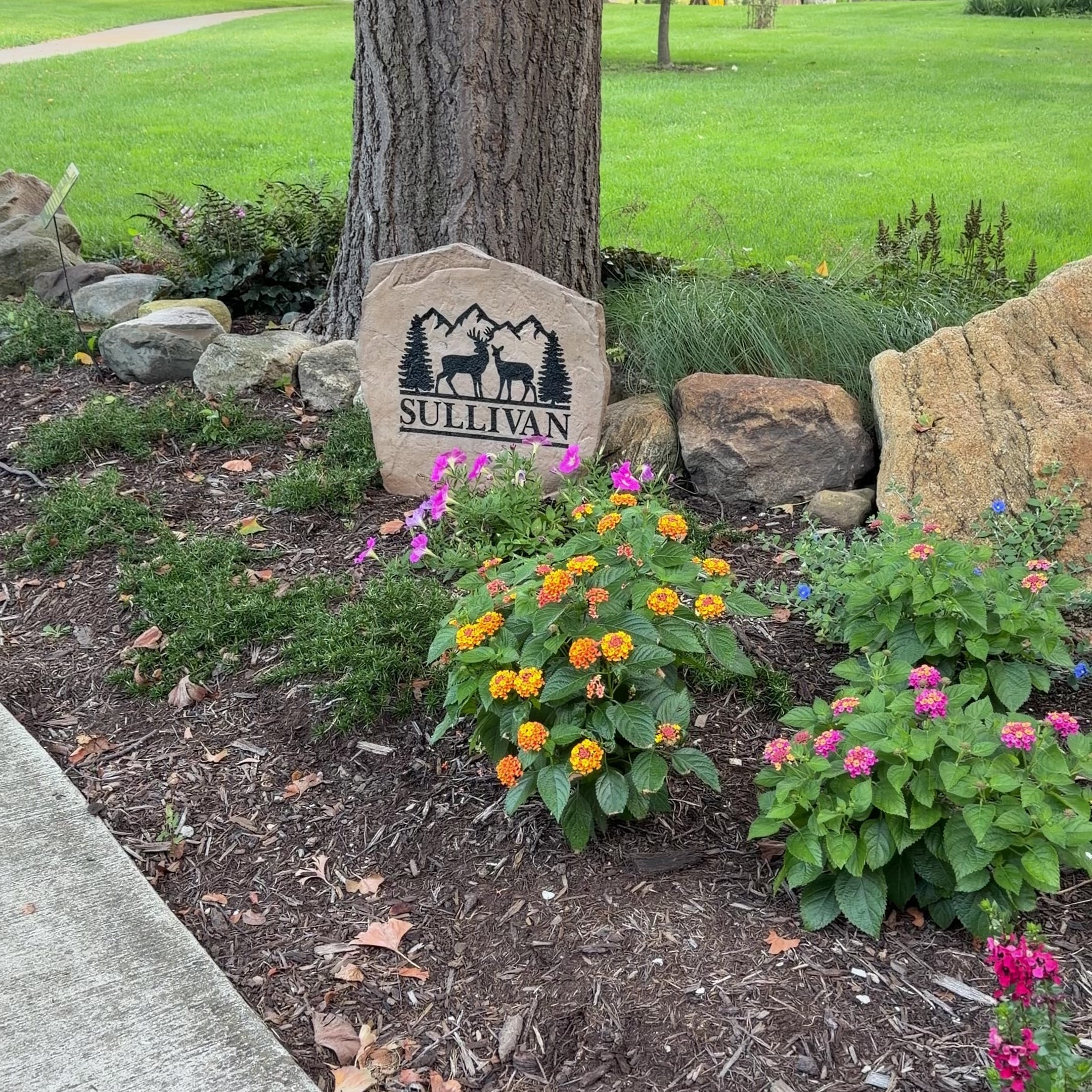 Personalized Deer Mountain Name Stone with engraved family name and outdoor mountain landscape design
