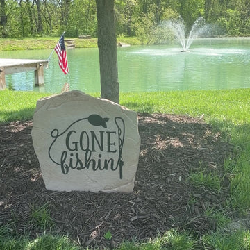 Fishing-themed landscape stone featuring the message "Gone Fishin'," ideal for cabins, ponds, riverfront properties, and backyard retreats.