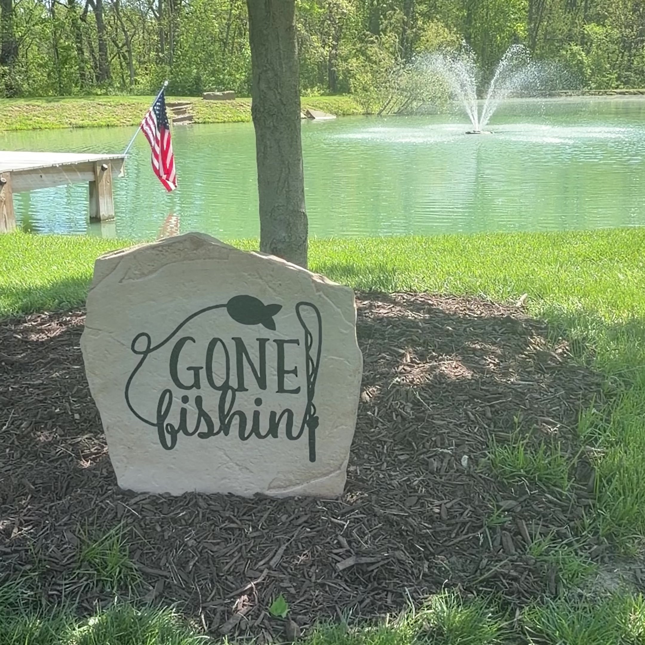 Fishing-themed landscape stone featuring the message "Gone Fishin'," ideal for cabins, ponds, riverfront properties, and backyard retreats.