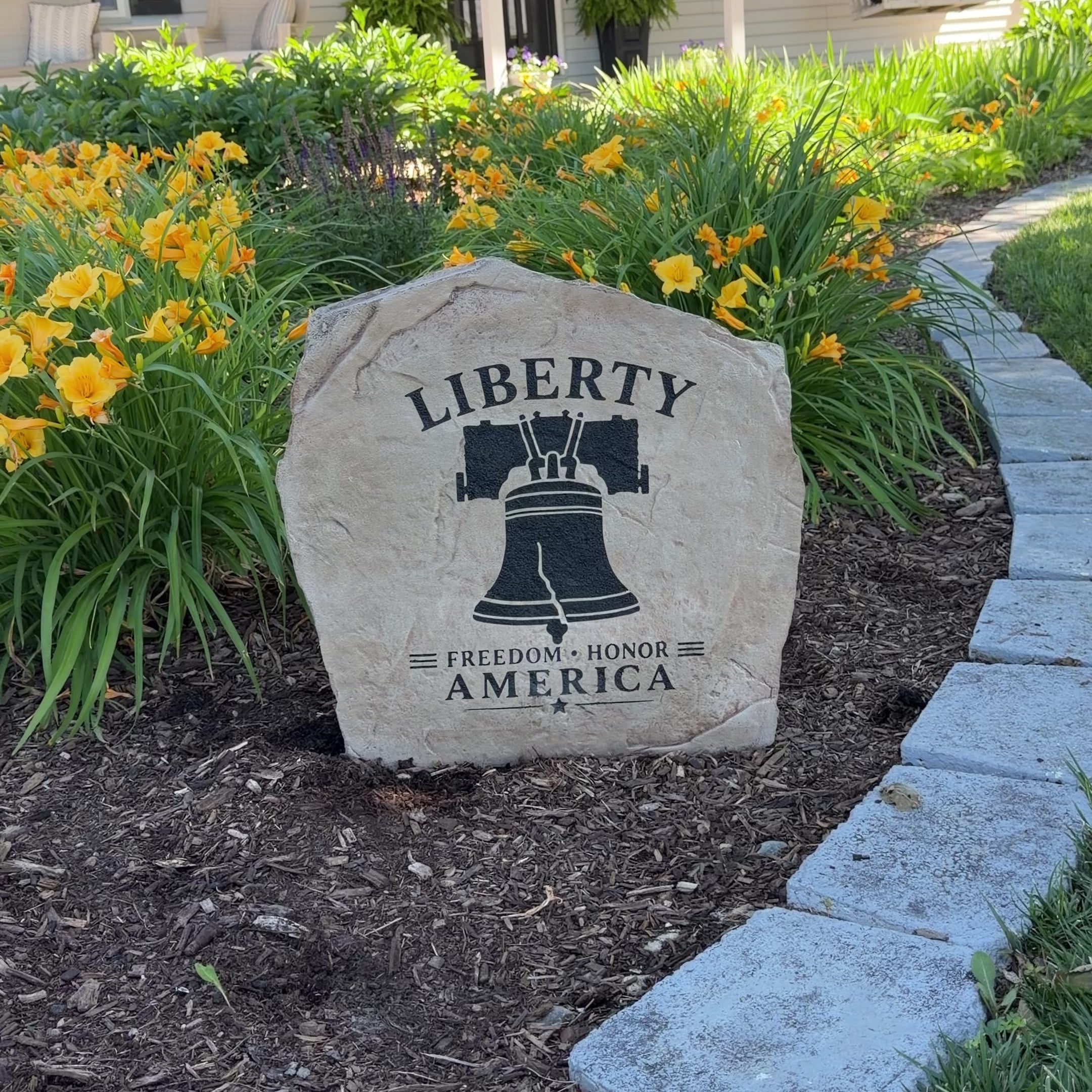Inspired by one of America’s most treasured symbols, the Liberty Bell Stone features a beautifully engraved bell design surrounded by words that celebrate freedom and honor. Displayed within a patriotic landscape setting, it creates a timeless centerpiece that proudly reflects America's heritage and enduring spirit.