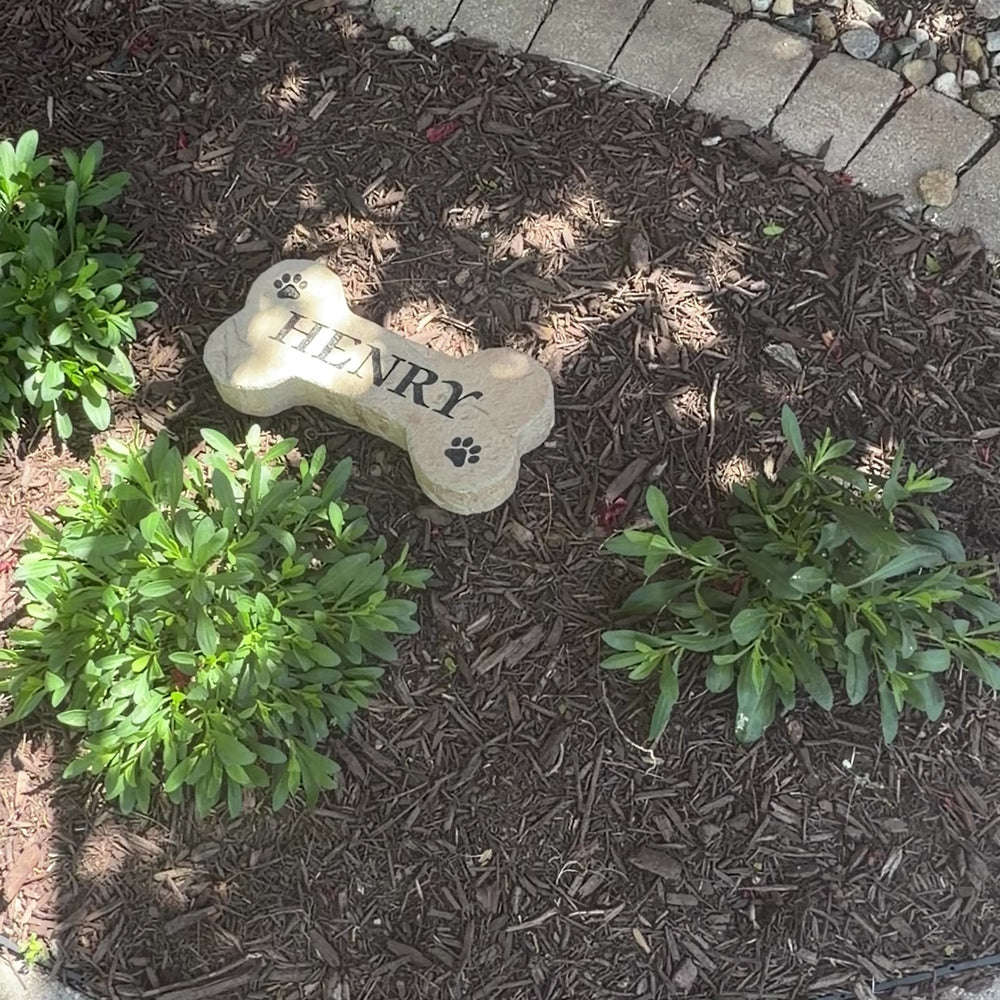 Video featuring the Dog Bone Stone, a personalized engraved pet memorial and decorative garden stone designed for dog lovers. Displayed outdoors to showcase its timeless beauty, durable craftsmanship, and the warm, welcoming touch it adds to a front yard, garden, or pet-friendly landscape.