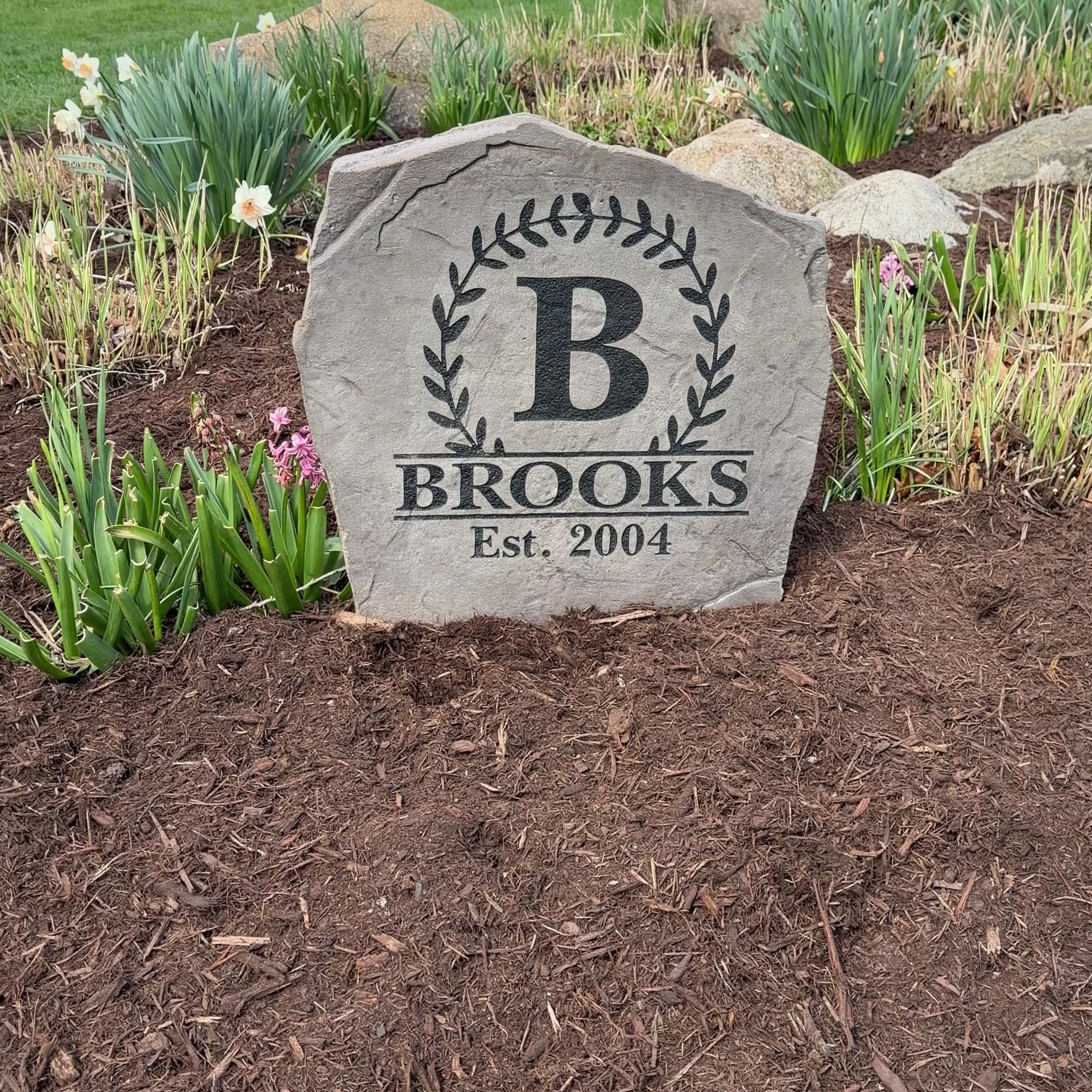 Personalized Vine Monogram stone displayed in elegant front yard landscaping for added curb appeal