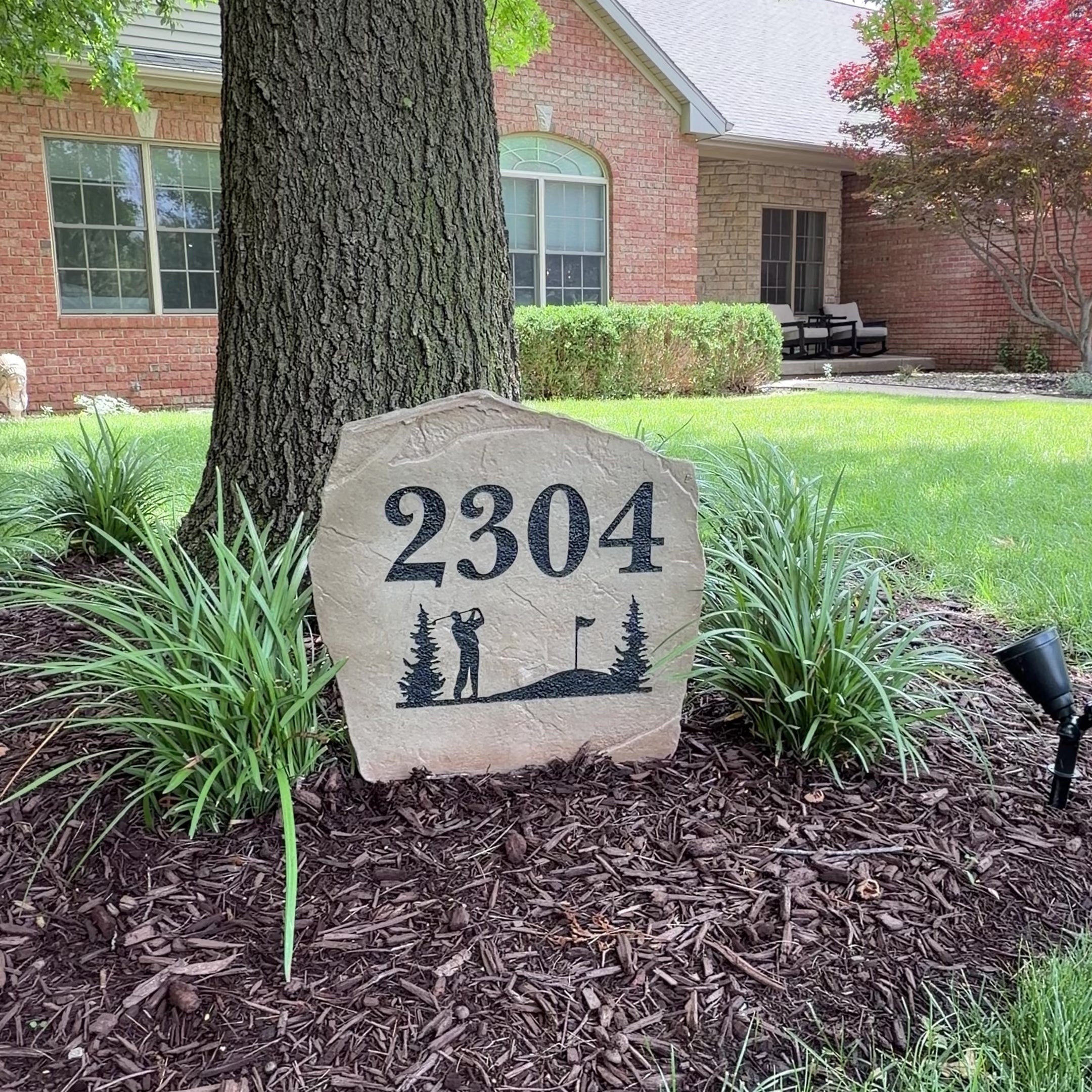 Video featuring the Golf Address Stone, a personalized engraved address stone designed for golf enthusiasts. Displayed outdoors to showcase its timeless craftsmanship, elegant style, and the unique curb appeal it adds to a front yard, garden, driveway entrance, or golf-themed landscape.