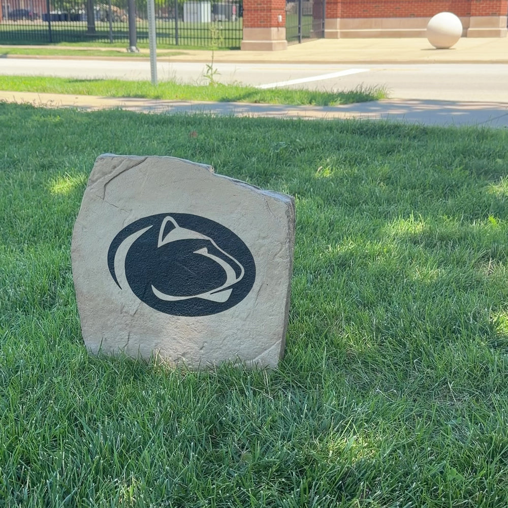 Officially licensed Penn State University Logo Stone featuring the iconic Penn State Nittany Lions logo engraved directly into the stone surface. This decorative garden stone adds collegiate spirit and curb appeal to front yards, patios, gardens, and entryways.