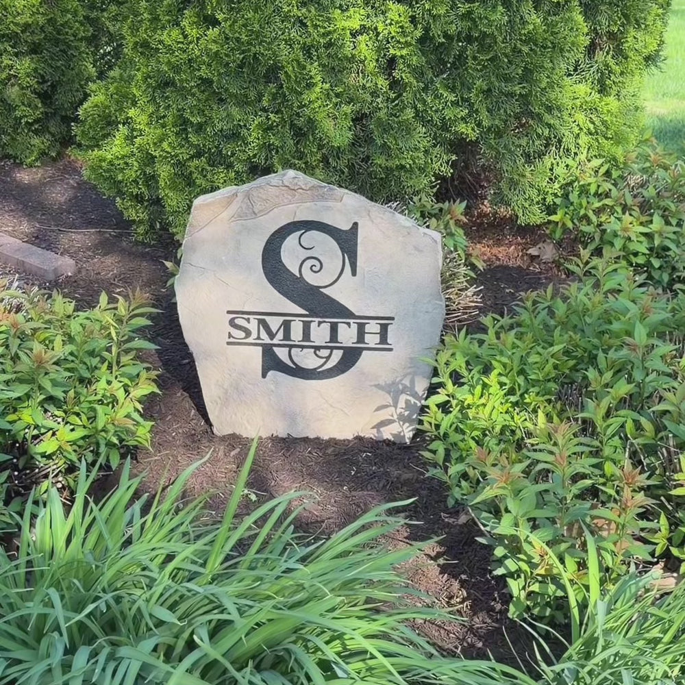 Classic and timeless, the Monogram Stone – Original features a beautifully engraved personalized initial that adds elegance to any landscape. Displayed among flowers and decorative greenery, it creates a sophisticated focal point that welcomes guests with custom charm and lasting beauty.
