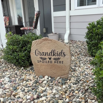 Video showcasing the Grandkids Spoiled Here Stone, an engraved decorative garden stone celebrating the joy of being grandparents. Displayed outdoors to highlight its timeless beauty, lasting craftsmanship, and the warm, welcoming curb appeal it adds to a front yard, garden, patio, or entryway.