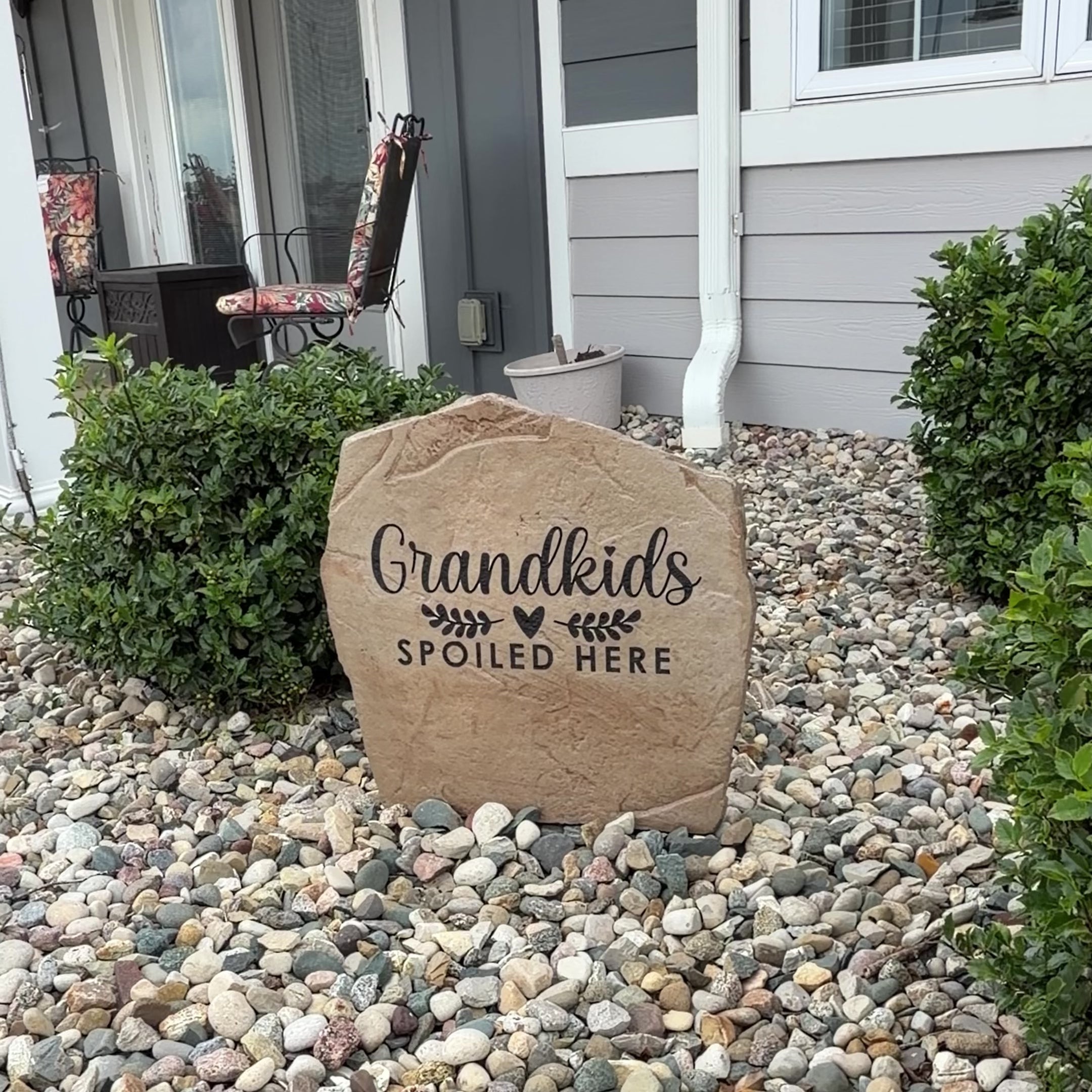 Video showcasing the Grandkids Spoiled Here Stone, an engraved decorative garden stone celebrating the joy of being grandparents. Displayed outdoors to highlight its timeless beauty, lasting craftsmanship, and the warm, welcoming curb appeal it adds to a front yard, garden, patio, or entryway.