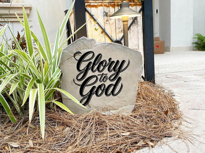 Durable outdoor memorial stone with religious inscription.