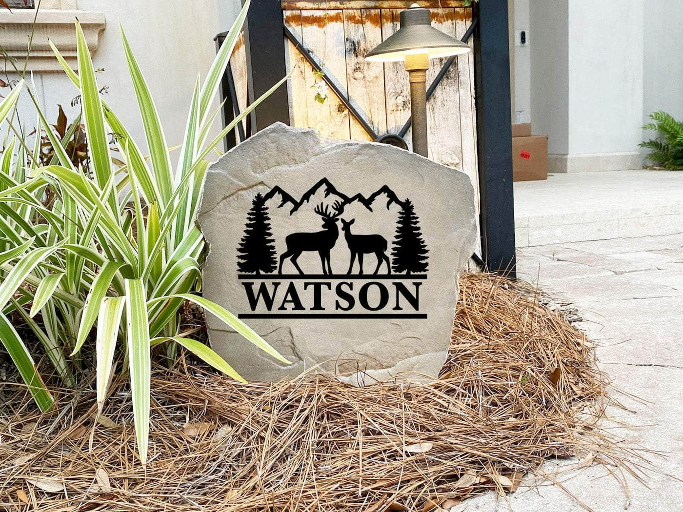 Personalized wilderness stone with forest and mountain design, ideal for garden décor.