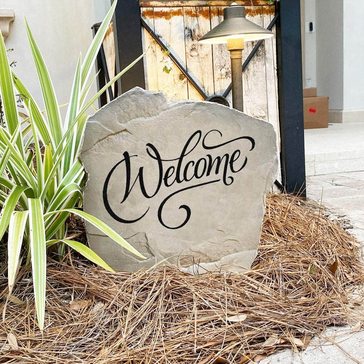 Classic welcome landscape stone designed to greet family and friends with an inviting message that complements any residential setting.