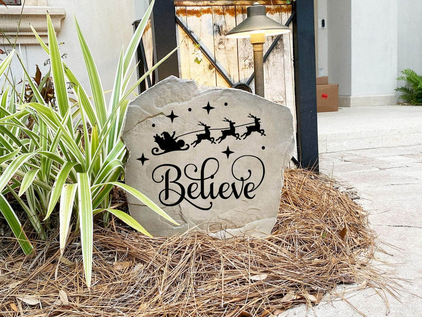 Outdoor Believe stone with engraved festive design