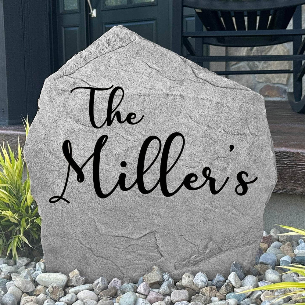 Personalized Script Name Stone engraved with your family name in elegant script lettering, creating a timeless landscape feature for your home.