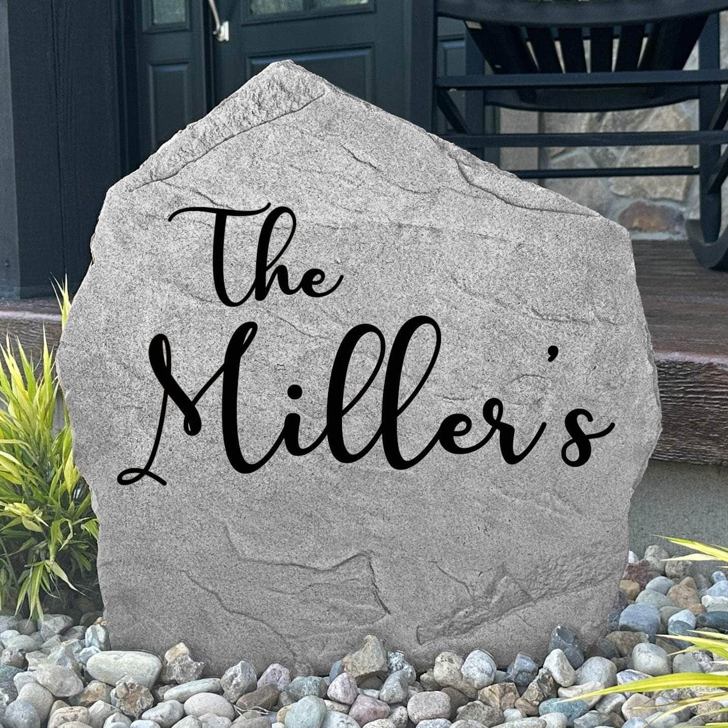 Personalized Script Name Stone engraved with your family name in elegant script lettering, creating a timeless landscape feature for your home.