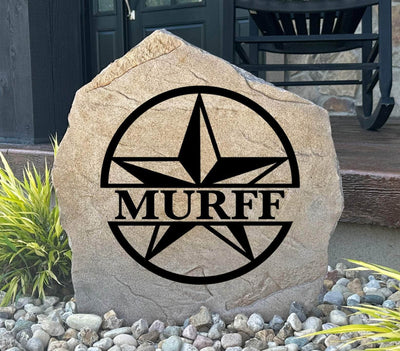 Personalized star monogram stone engraved with family name for landscaping.
