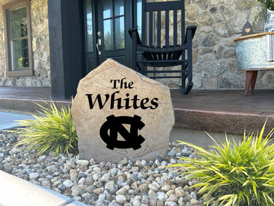 Engraved family name stone for outdoor display with North Carolina logo