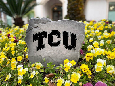 TCU decorative logo stone in front entry landscaping