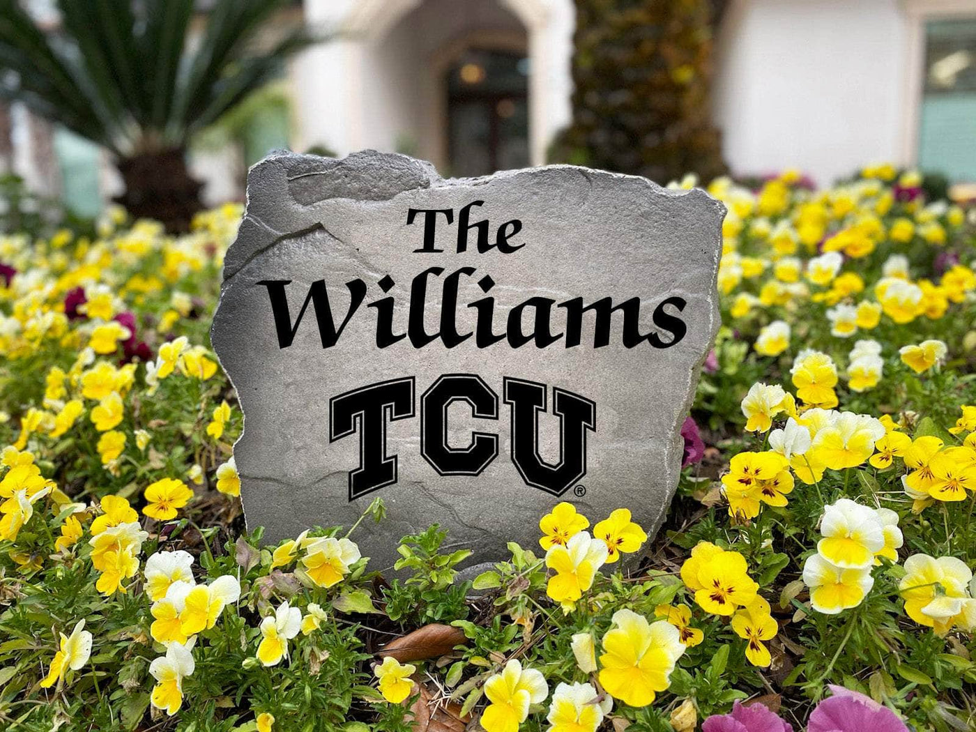 TCU engraved name stone adding a decorative touch to outdoor space