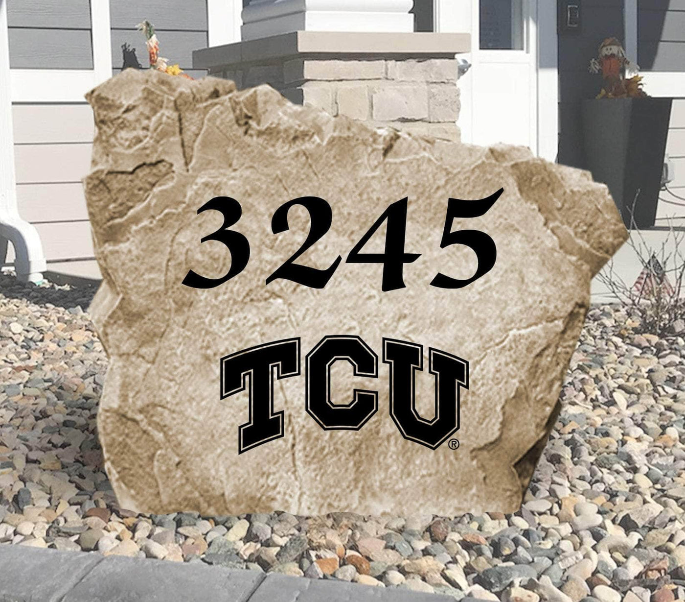 
Texas Christian University engraved address stone placed in elegant landscaping