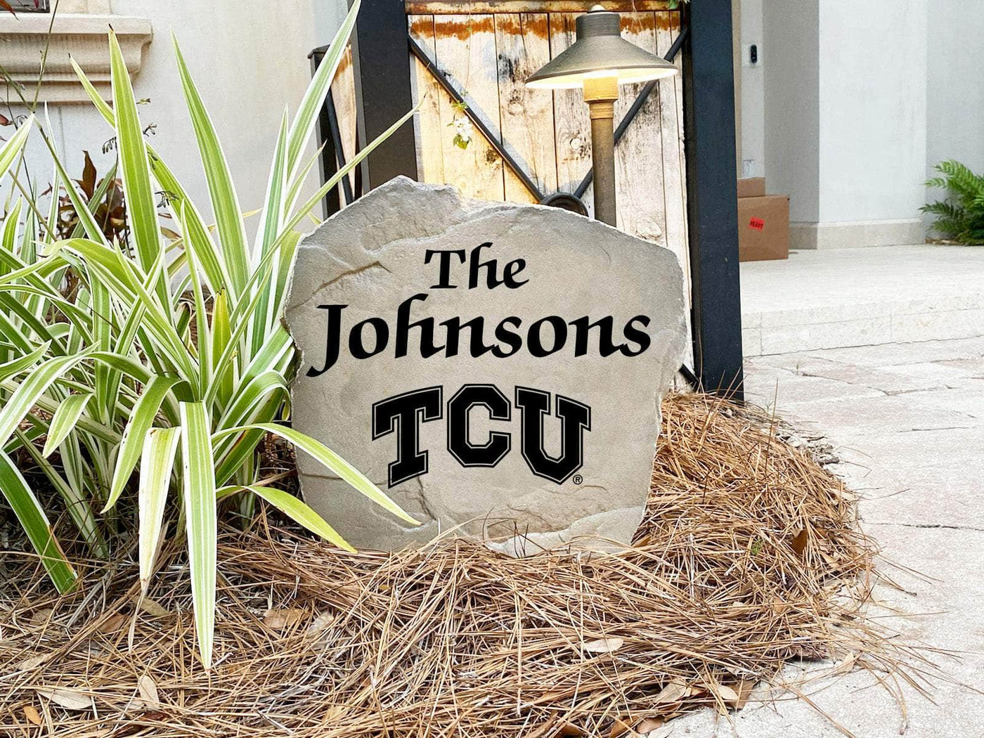 Texas Christian University name rock showcasing school pride in landscaping