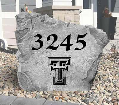 Custom landscaping stone featuring Texas Tech logo and house number