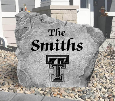 Custom landscaping rock featuring Texas Tech logo and name