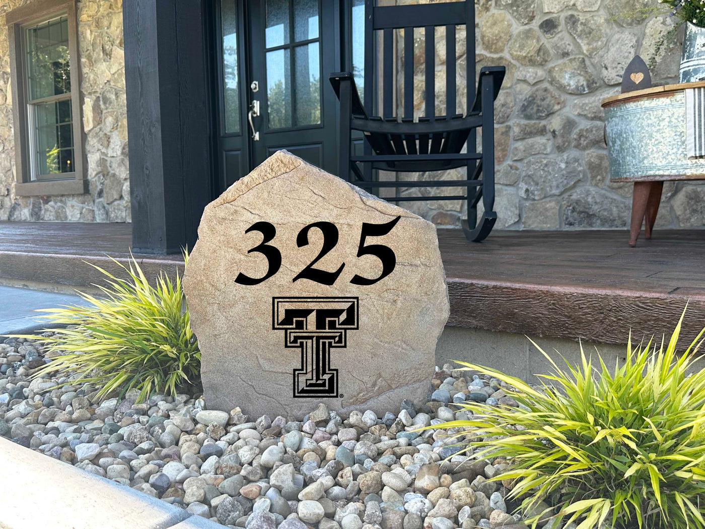 Durable outdoor stone displaying Texas Tech logo and street number