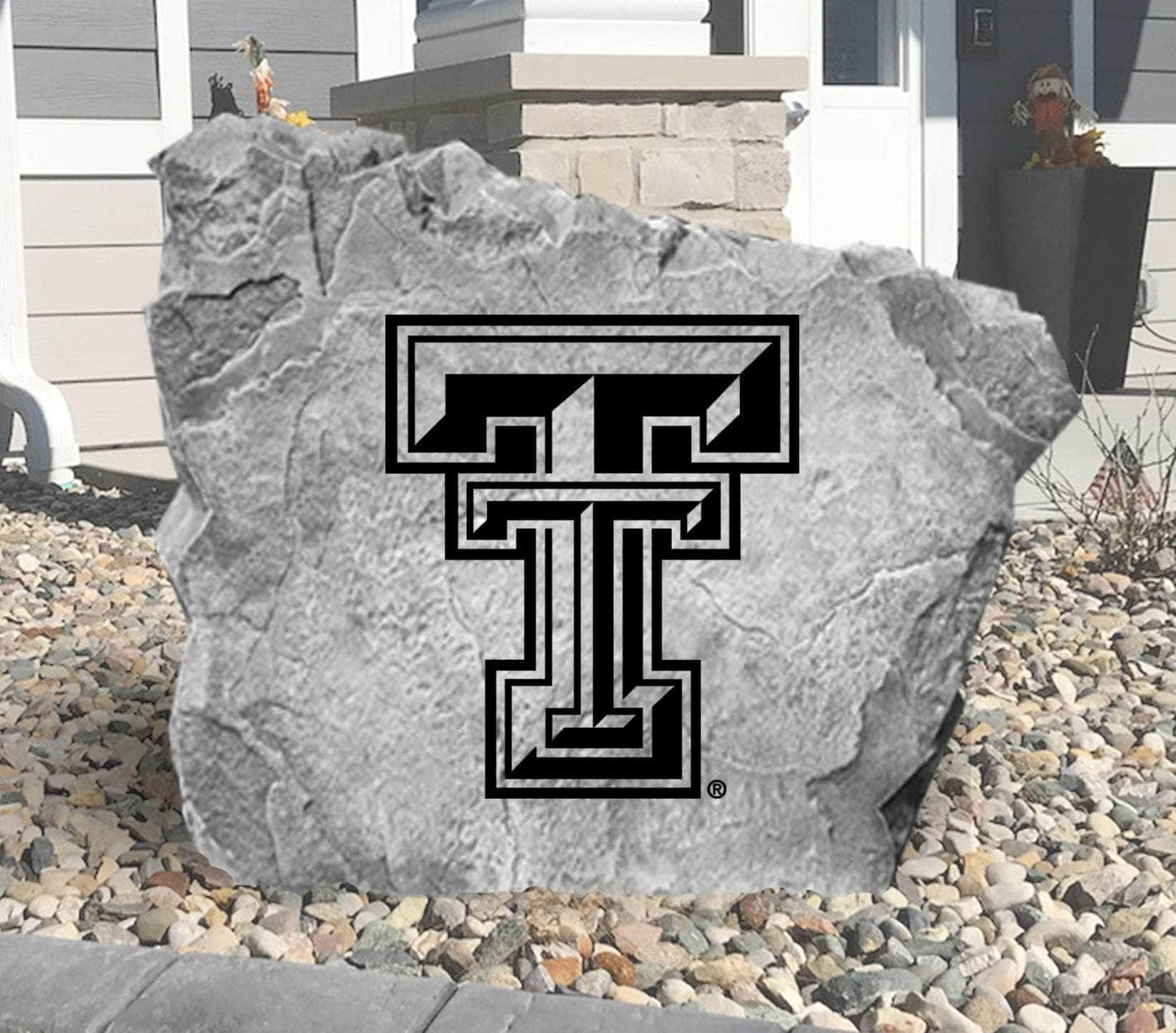 Outdoor landscaping rock with Texas Tech emblem