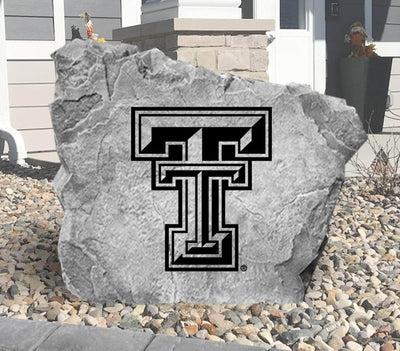 Outdoor landscaping rock with Texas Tech emblem