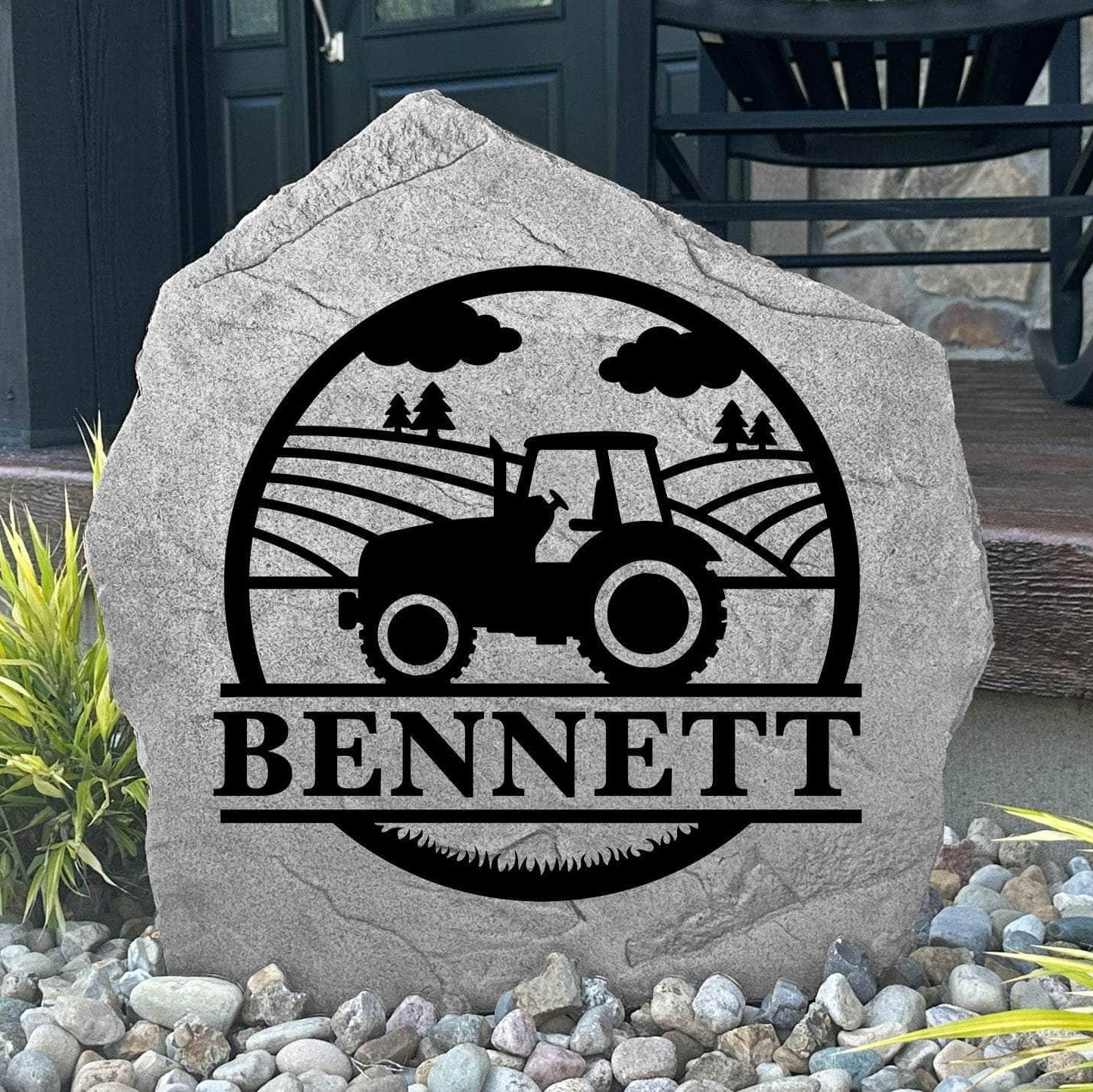 Custom Farm Monogram Stone displayed in a landscaped flower bed, showcasing personalized engraving and country-inspired artwork. This engraved outdoor stone creates a beautiful focal point for gardens, walkways, and farmhouse entrances.