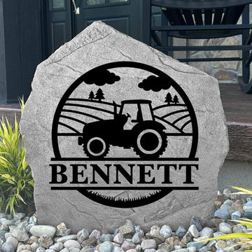 Custom Farm Monogram Stone displayed in a landscaped flower bed, showcasing personalized engraving and country-inspired artwork. This engraved outdoor stone creates a beautiful focal point for gardens, walkways, and farmhouse entrances.
