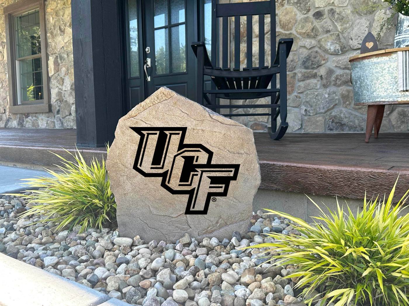 Outdoor pride display stone featuring UCF Knights logo engraving.