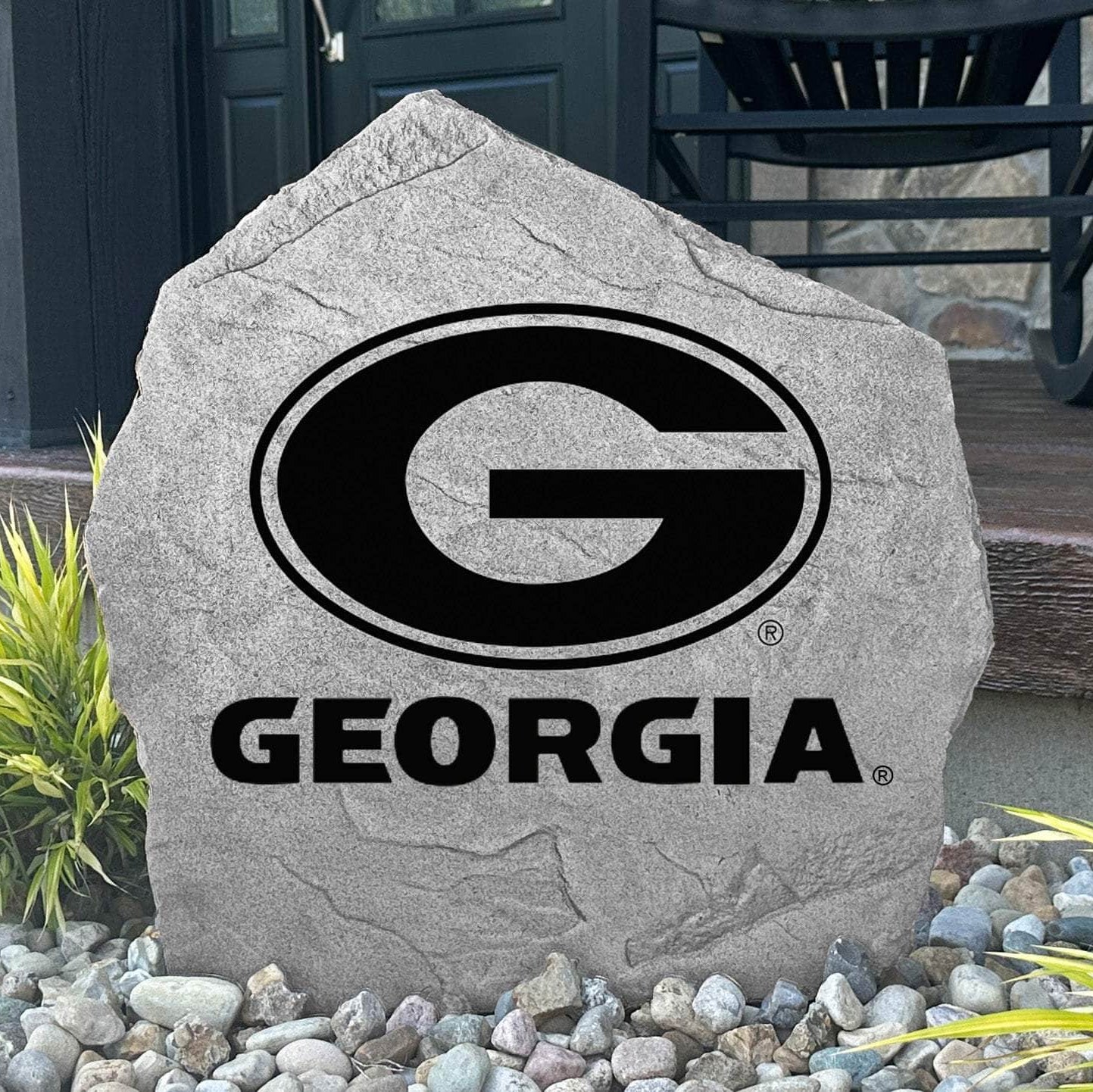Custom Georgia Bulldogs Logo Stone displayed in a landscaped flower bed, showcasing officially licensed team artwork permanently engraved into the stone. This outdoor accent creates a beautiful focal point for alumni homes and devoted Bulldogs fans.