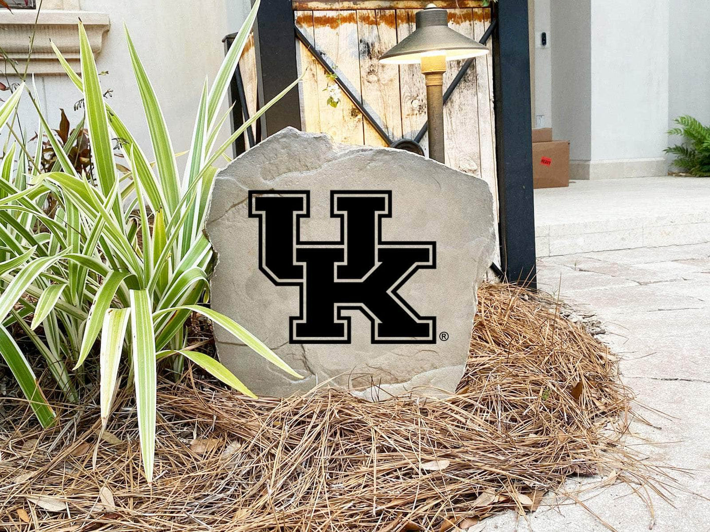 Decorative stone with Kentucky Wildcats emblem for garden