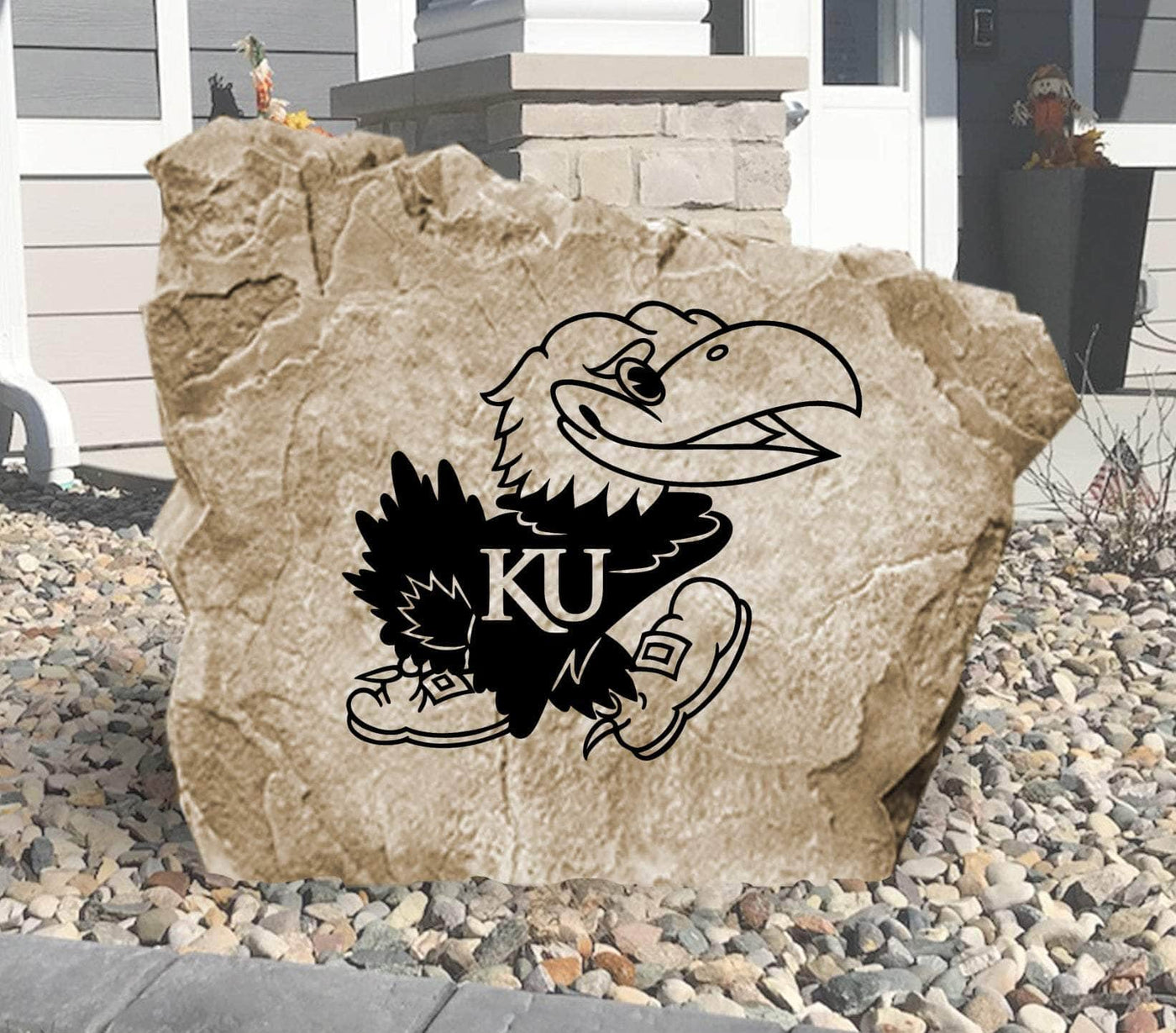 Engraved University of Kansas Jayhawks logo on outdoor stone
