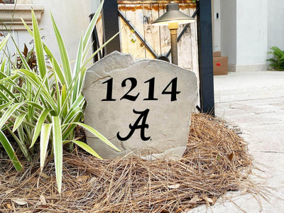 University of Alabama address marker stone with engraved numbers.